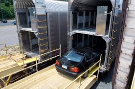 Enclosed auto transport by rail