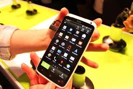HTC One X held in a hand